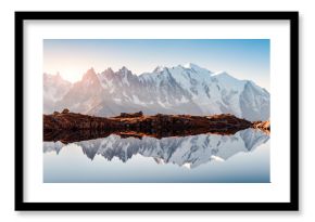 Incredible view of clear water and sky reflection on Chesery lake (Lac De Cheserys) in France Alps. Monte Bianco mountains range on background. Landscape photography, Chamonix.