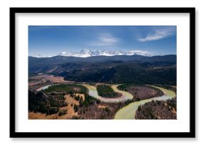 Aerial photo landscape winding river Chui meanders in mountains, forest trees with sunlight, Altai Russia, top view