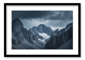 A low angle shot of high Rocky Mountains under a cloudy sky with empty copy space for text