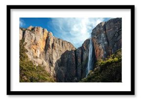 Majestic waterfall cascading down steep cliffs in Tasmania's breathtaking landscape, Tasmania high waterfall drops from tall cliff in mountains Montezuma falls