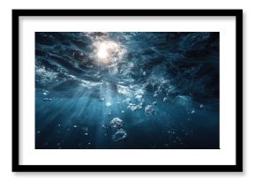 Bubbles beneath the water and sunlight penetrating the ocean surface