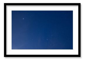 Night sky with stars and planetary light in deep blue