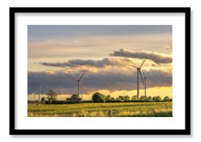 Wind turbines field. Wind power station. Evening sky
