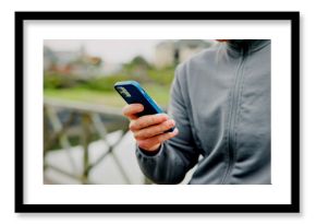 Exercise, break and hands with phone on bridge for fitness app, check stats or workout performance. Runner, person and smartphone in nature for cardio progress, track running speed and training timer