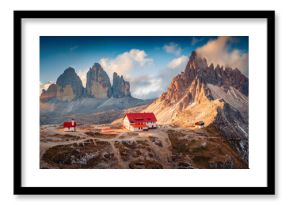 Fantastic summer sunrise on Dolomites with Paternkofel and Tre Cime Di Lavaredo mountain peaks on background, Italy. Wonderful morning scene of Italian Alps. Beauty of nature concept background.