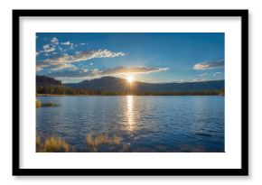 Marriage ceremony beneath the sun by a tranquil lake