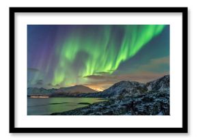 Tromso Norway, aurora borealis northern lights winter landscape at Rorvikneset Sommaroy