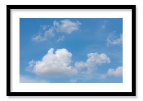 Clear blue sky with fluffy white clouds