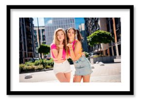 Sunny urban duo playful sisters vibe and fashion moment in city street with bright outfits