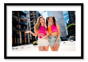 Fun sunny city duo embrace bright fashion vibes two stylish friends explore urban streets with smiles and energy on a sunny day in a modern traveler lifestyle moment
