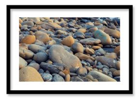 Deserted rocky pebble beach. Abstract nature pebbles background. Pebbles texture. Stone beach. Horizontal banner