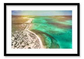 Panoramic aerial view of Osprey Bay WA with boats, reef, and scenic shoreline under bright sunlight