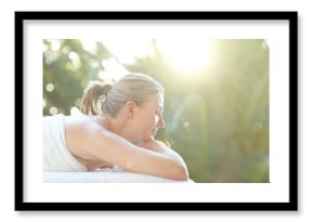 Woman, rest and sleep at spa outdoor for sunlight therapy, fresh air and pamper session. Female person, nap and lens flare for holistic wellness, natural healing and dreaming for self care at retreat