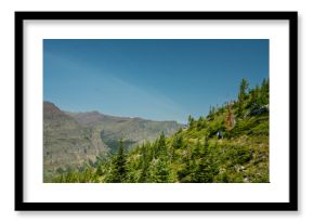 Backpacker Hikes Along Open Trail In Backcountry Of Glacier