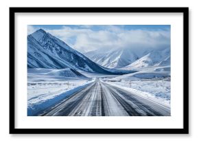 Scenic winter highway winding through snow covered mountains in alaska, showcasing a breathtaking landscape of pristine wilderness