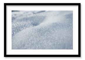 serene close-up of sparkling fresh snow, capturing delicate crystal textures illuminated by sunlight. Soft curves and gentle shadows create a peaceful winter atmosphere