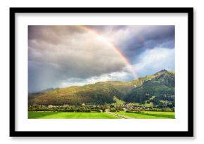 Rainbow over Green mountain peaks with clouds in Austrian Alps at summer in Kaprun, Hohe Tauern - Maiskogel