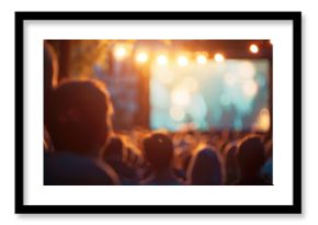 Blurry images of a magical outdoor movie night with a hazy screen and dimlylit audience.