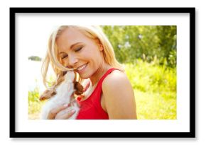 Woman, happy and puppy in park with hug, pet care and excited for adoption approval. Person, dog companion and smile in nature with support animal, new best friend and bonding for anxiety relief