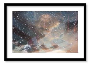 Raindrops falling against cloudy sky, creating serene and calming atmosphere