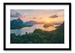 A stunning sunset view over a tranquil lake surrounded by lush mountains and greenery, showcasing nature's beauty and serenity.