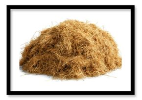 A pile of dry, golden-brown hay or straw sitting on a plain white surface