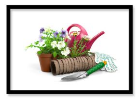 Flowers with garden tools isolated on white background