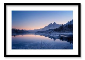 Amazing winter wonderland with mountains and lake. Designed using Generative AI.