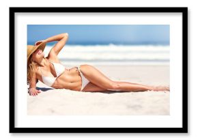 Woman, beach and bikini on sun tanning on holiday vacation, summer relax or ocean outdoor peace. Female person, hat and nature for confidence in clean air for weekend travel, water swimsuit in Bali