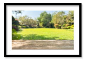 Empty wood table top with abstract blur park garden background