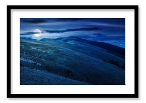 mountain landscape with green meadows in summer at night. picturesque travel destination wallpaper concept. scenery with rolling hills in full moon light