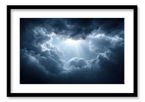 Dramatic dark stormy sky with thick clouds opening to reveal bright sunlight rays breaking through, creating powerful and moody atmosphere