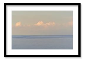 scenic sunrise or sunset above sea water with beautiful ocean vawes , nice golden evening clouds above horizon and awesome blue sky