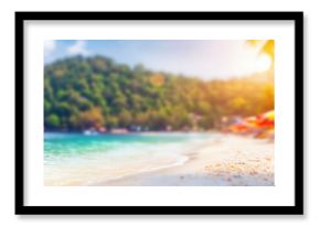 Sunny beach view with blurred colors and umbrellas for relaxation