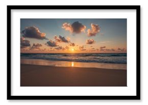 Stunning photo showcasing a mesmerizing sunset over the ocean shore. Every pixel radiates natural splendor. Ideal for serene and seaside motifs.