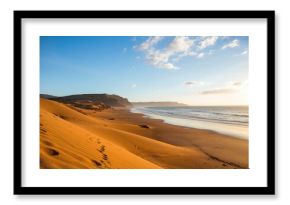 Desert landscape converges with ocean along a rugged coastal area