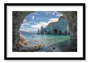 Rocky marble caverns on a serene lake in a southern wilderness