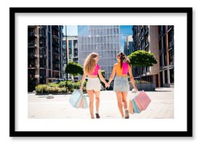 Playful city stroll with best friends carrying colorful shopping bags under a sunny urban skyline while exploring fashionable streets together and enjoying a summer day