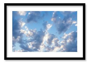 Sunny clear blue sky with white and gray clouds. Seasonal cloudscape. Nature background for environment, climate, and weather forecasting.