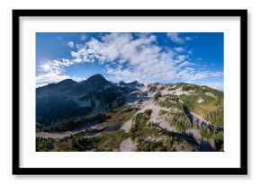 Panoramic Alpine Mountain Range With Glacial Lakes In British Columbia, Canada Under A Bright Blue Sky