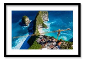 Aerial drone view of Kelingking Beach with construction crane on clifftop