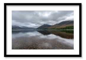 Annascaul lake in County Kerry features flat waters with salmon, surrounded by mountains, highlighting the area's natural beauty and tourism appeal.