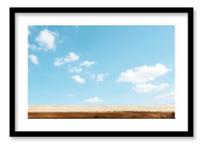 Top wooden table with sky blue with cloud texture background for mocking up or display product to make advertising.