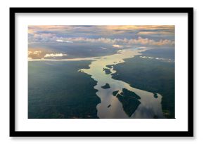 The Essequibo and Cuyuni rivers in the Amazon rainforest of Guyana at sunset. South America