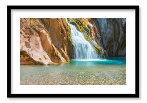 Tranquil Oasis: Crystal Clear Waterfall in Rocky Paradise