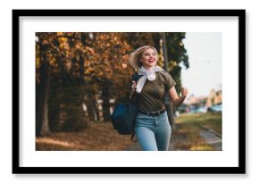 Photo of positive young blonde girl running hurry shopping wear khaki outfit tied shoulders sweater walk park sunny spring weather outside