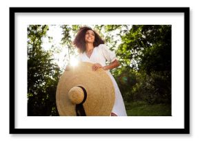 Photo of good mood positive girl wear stylish big straw sunhat panama walk summer sunny day outdoors