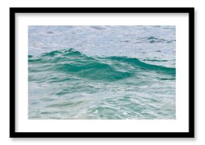 The ocean is calm and the water is a beautiful shade of blue