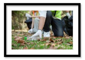 Teamwork and Eco-consciousness. Volunteers gather trash in a park, demonstrating teamwork and community spirit during a sustainability-focused cleanup.