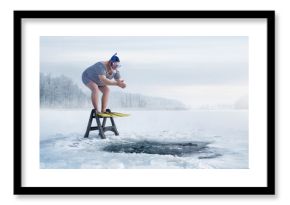 Fuunny overweight, retro swimmer about to jump into ice hole in the lake, with copy space